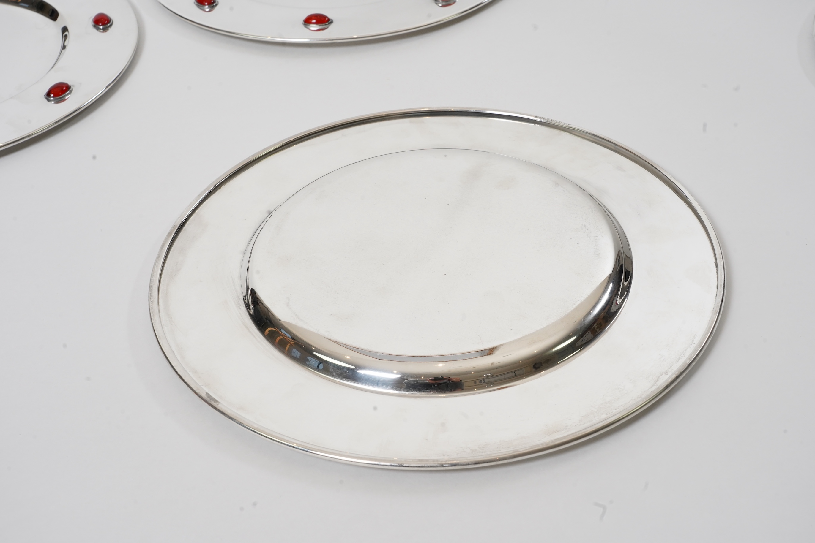 A set of six Glasgow School Arts & Crafts silver plated and cabochon glass set dinner plates
